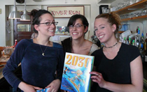 3 women reading at River Run Cafe